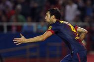 Barcelona's midfielder Cesc Fabregas celebrates after scoring against Sevilla